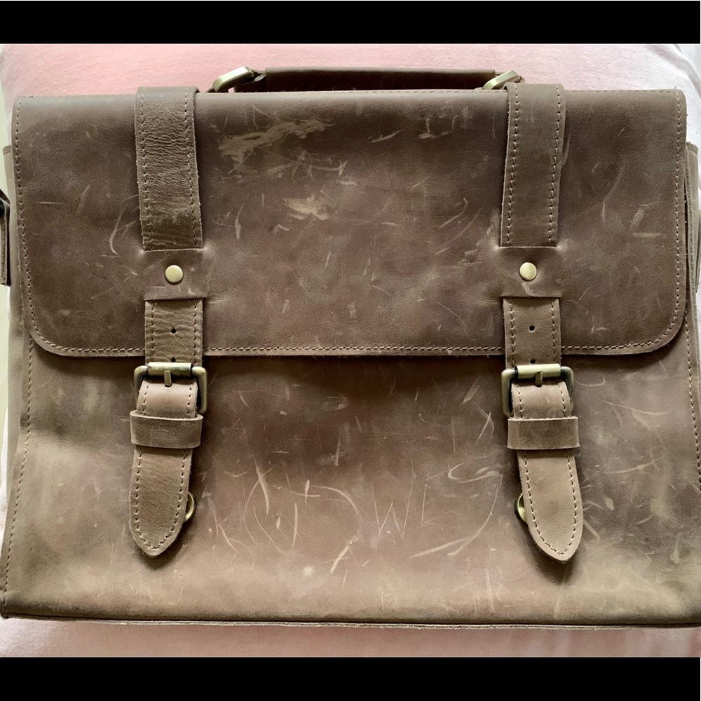 Artisan raw leather messenger / laptop bag.